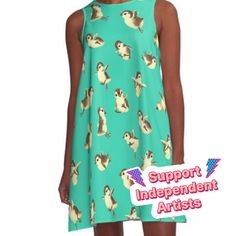 a woman wearing a green dress with ducks on it and the words support independent artists