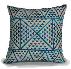 a blue and white pillow with triangles on it