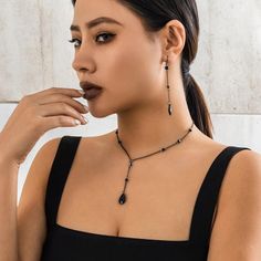 ✨ Black Onyx Long Drop Necklace ✨ Make a statement of elegance and simplicity! This stunning black onyx necklace features a sleek, long drop design that's both versatile and eye-catching. Whether you're dressing up for a special occasion or adding a touch of sophistication to your everyday look, this piece is your perfect go-to. 🔗 Chic & Timeless Design The bold black onyx gem is suspended on a delicate chain available in gunmetal grey or gold - effortlessly complementing any style. Its 18-19" Chain Aesthetic, Long Drop Necklace, Chains Aesthetic, Pendant Choker Necklace, Crystal Water, Black Onyx Necklace, Aesthetic Jewelry, Neck Accessories, Pendant Choker