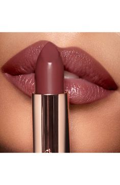 What it is: A twist on Charlotte's best-selling Pillow Talk lipstick, now in a deep intense berry rose shade.What it does: This beloved shade is dialed up to a deeper hue for every one and every mood. It's presented in the super moisturizing K.I.S.S.I.N.G. formula and looks extra dreamy on tan and deep skin tones for a sumptuous, satin-finish pout.How to use: Start by applying your lip liner. Beginning on the outer corners, trace the liner just outside the natural lip line. Apply the lipstick ei Pillow Talk Lipstick, Rose Lipstick, Makijaż Smokey Eye, Deep Skin, Natural Lip, Makeup Pictures