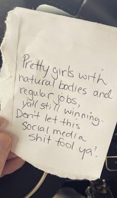 a person holding up a piece of paper with writing on it that says pretty girls wish natural babies and regular pops