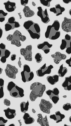 black and white animal print wallpaper with glitter hearts on the left side of the image