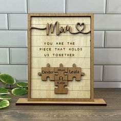 a wooden puzzle with the words mom on it