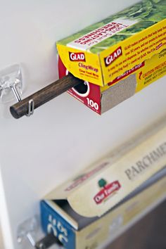 a box of food hanging from the side of a refrigerator