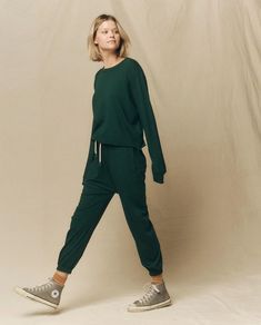 The Long Sleeve Crop Tee. -- Green Grove – The Great. Cropped Tee, Wardrobe Style, Long Sleeve Crop, Seasonal Fashion, Crop Tee, Jogger Pants, Jersey Fabric