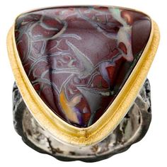 A fascinatingly unique 21 x 25 mm trillium cabochon of Australian Koroit Boulder Opal is highlighted with an 18K gold bezel surrounded by a line textured double bezel atop a comfortable flattish organically textured contrasting dark oxidized sterling shank. This ring is currently sized 8, and is somewhat difficult to resize. Koroit boulder opal is only found in one region of Queensland, Australia. Amazing contrasts and one-of-a-kind without a doubt! Line Texture, 18k Gold Ring, Queensland Australia, 3 Carat, Boulder Opal, Queensland, Cocktail Rings, Bouldering, Karate