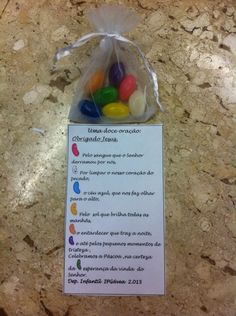 a bag filled with lots of candy on top of a marble countertop next to a sign