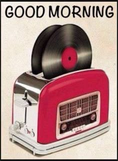 a red toaster with vinyl records on top