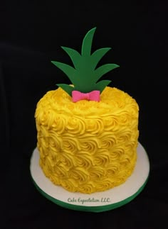 there is a yellow cake with a pineapple on top