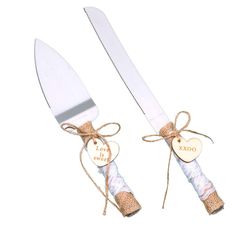 two wedding cake knives tied with twine and heart shaped tags on the handles are shown against a white background