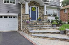 a house with stone steps leading up to the front door