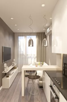 a modern kitchen with white cabinets and black counter tops, along with a dining room table