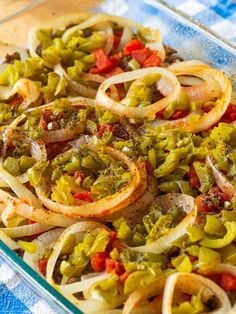 a casserole dish with onions and peppers