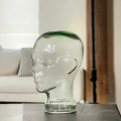 Our vintage solid glass mannequin head is a unique boutique decor piece, perfect for displaying hats, wigs or sunglasses. With its vintage charm and modern design, this piece could also serve as art in an urban modern home. Measures 11" tall x 7" x 9". * Vintage solid glass mannequin display head * Measures 11" tall 7" wide x 9" deep * No chips or cracks noted * Heavy, sturdy, thick glass * Glass is clear taking on a green hue depending on angle viewed * Age is estimate only* Free domestic shipp Glass Head Decor, Bug Keychain, Unique Mannequin, Glass Head, Head Display, Mannequin Display, Boutique Decor, Urban Modern, Accessories Display