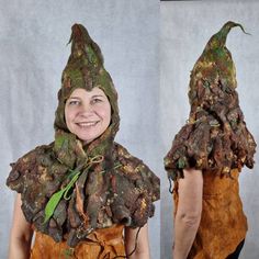 the woman is wearing a costume made out of tree bark and has green leaves on it