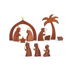 wooden nativity figurines depicting the birth of jesus and his three wise men