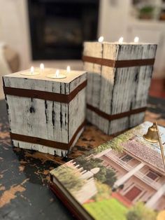 two wooden candles are sitting on a table