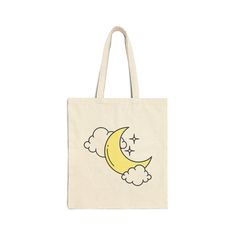 a tote bag with the moon and clouds on it