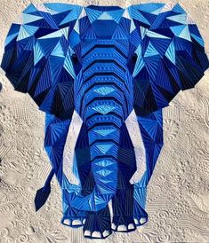 an elephant made out of blue geometric shapes