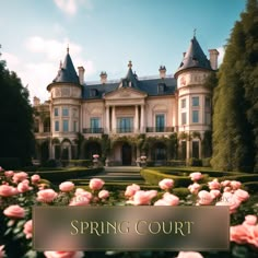 a large building with pink flowers in front of it and the words spring court on top