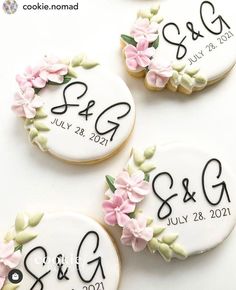 three decorated cookies with wedding date on them