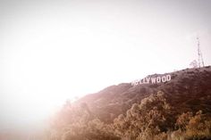 the hollywood sign is on top of a hill