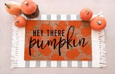 a door mat that says hey there pumpkin on it