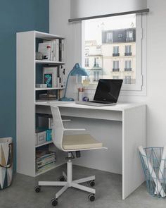 a white desk with a laptop computer on top of it next to a book shelf