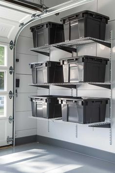 several bins are stacked on the wall next to each other in a storage room