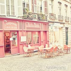 the outside of a restaurant with tables and chairs