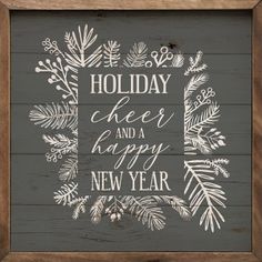 a wooden sign that says holiday cheer and a happy new year with pine branches on it