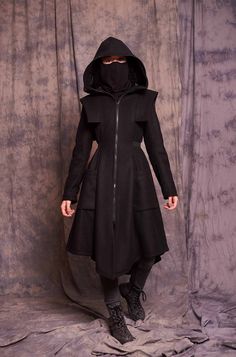 ♥ EXPRESS worldwide shipping - buy your favorite piece today and wear it within just 1-3 days upon shipping ♥ This black winter coat with a zip-up face shield will keep you safe and cozy! With its shoulder accents and waist belt the coat is extremely flattering to any body shape! The black bandana face mask is not included in the price, you can find it as a separate item here: https://www.etsy.com/listing/795188463/face-mask-washable-neck-gaiter-mask?ref=shop_home_active_4&pro=1 ♥ Material: Black Military Winter Outerwear, Black Coat Women, Techno Vibes, Women Wool Coat, Black Coat Outfit, Winter Coat Black, Black Hooded Coat, Bandana Face Mask, Long Winter Coats Women