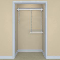 an empty closet with white shelving and shelves