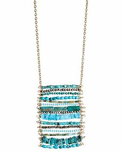 a gold chain necklace with blue beads and green glass beads hanging from the front, on a white background