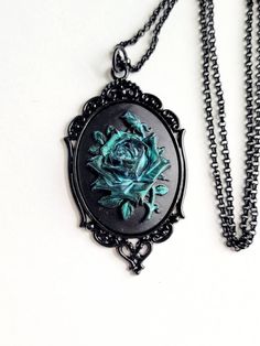 JUST LISTED Green Iridescent Rose Gothic Rockabilly Cameo Black Necklace Pendant Victorian Jewelry Hand painted cameo If you are wanting a specific color of roses please feel free to contact me and I will do my best to create what you are searching for. Victorian Jewelry substantial in size at just a little over 2 INCHES Long Center is 40mmx30mm **MATCHING ITEMS IN OUR STORE BADGE HOLDER BROOCH HAIR PINS - CLIPS** **thank you for taking the time to look at our items. Each item is handcrafted and Color Of Roses, Gothic Rockabilly, Teal Necklace, Wood Bead Necklace, Gothic Steampunk, Jewelry Hand, Cameo Necklace, Black Necklace, Victorian Jewelry