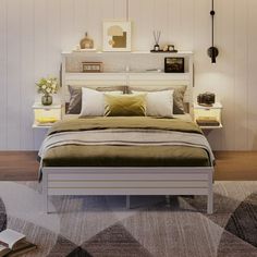 a bedroom with a bed, nightstands and pictures on the wall above it in white wood paneling