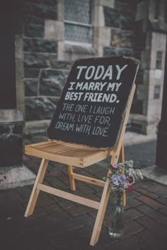 a wooden chair sitting on top of a brick floor next to a sign that says today i marry my best friend