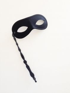 Unisex Hand Free Stick mask for men and women. Perfect for any masquerade ball or costume party. S H I P P I N G - Processed same day or within 24 hours. 1-2 day guaranteed delivery services offered, add items to cart and click on shipping tab for rates. Pls leave a check out note with your need date & contact number Msg for delivery time frames (Include your state/country). S I Z E Adult Size. Detailed dimensions available upon request. C U S T O M I Z A T I O N Mask can be studded with oth Black Mask Masquerade, Masquerade Mask With Stick, Elegant Face Mask, Black Masquerade, Black Masquerade Mask, Mask Venetian, Masquerade Outfit, Mens Masquerade Mask, Venetian Masquerade Masks