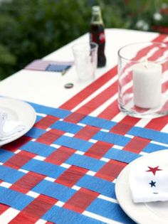 the table is set with red, white and blue napkins