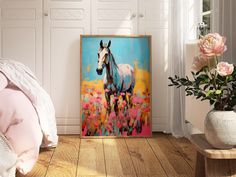 a painting of a horse is on the wall next to a bed and vase with flowers