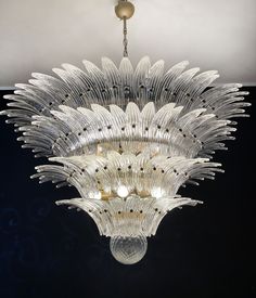 a glass chandelier hanging from the ceiling