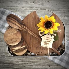 there is a cake with sunflower and spoons in it