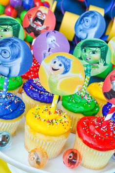 there are many cupcakes with cartoon characters on them