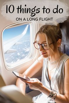 a woman looking at her tablet while sitting on an airplane with the words 10 things to do on a long flight