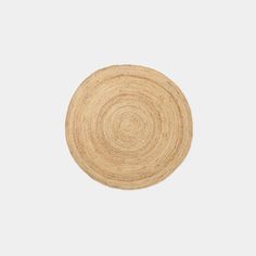 a round wooden coaster on a white background