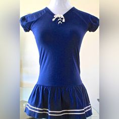 New “Sailor-Frescu Blue” Girls Short Sleeve Dress Ralph Lauren Size 5 Navy With White Cord Draw String At Neck With 2 White Stripes On Ruffle Bottom Navy Embroidered Polo Upper Left 100 % Cotton Pit To Pit 13 Inch Navy Cotton Casual Dress, Summer School Uniform Dress With Short Sleeves, Summer Short Sleeve School Uniform Dress, Preppy Navy Cotton Dress, Blue Sailor Cotton Dress, Blue Sailor Style Cotton Dress, Sailor Style Blue Cotton Dress, Blue Cotton Sailor Dress, Nautical Navy Cotton Dress