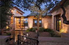 an exterior view of a modern home at night