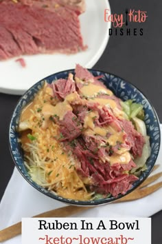 a bowl filled with corned beef and coleslaw next to a plate of corned beef