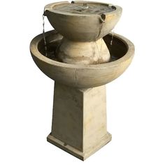 a concrete fountain with water coming out of it's sides, on a white background