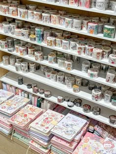 the shelves are filled with many different types of cards and paper goods for sale on them